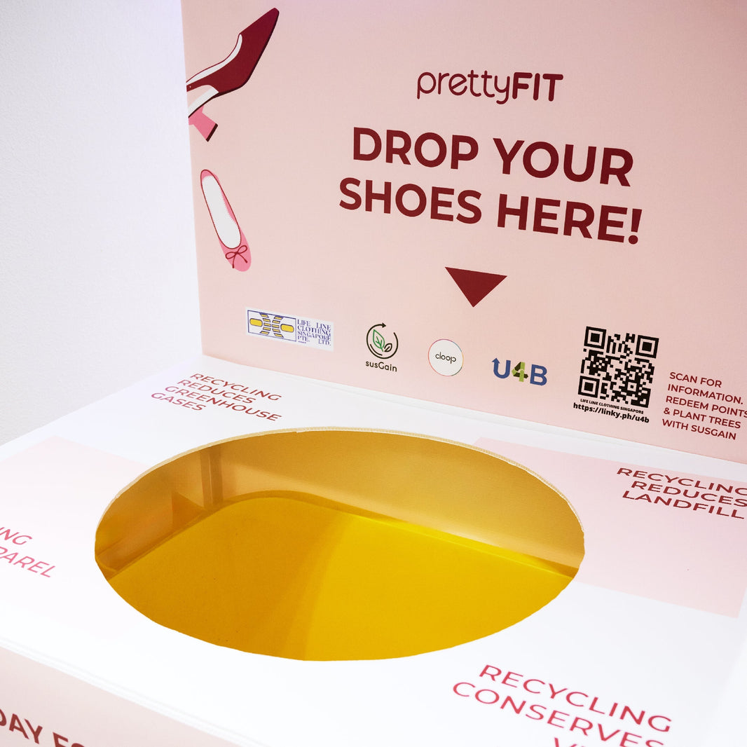 prettyFIT x Cloop pink recycling bin with 'Drop Your Shoes Here' and 'Zero Waste to Landfill'—part of a sustainable shoe recycling campaign.